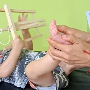 Reflexology being performed on a baby